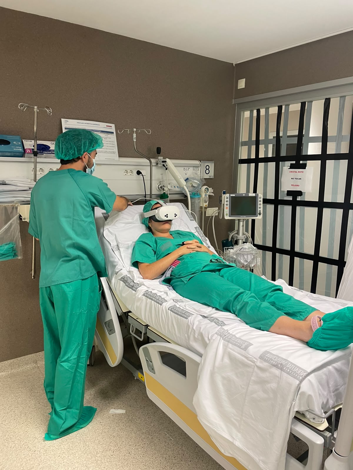 Patient wearing a mixed reality headset while clinical staff prepare the MixCare experience