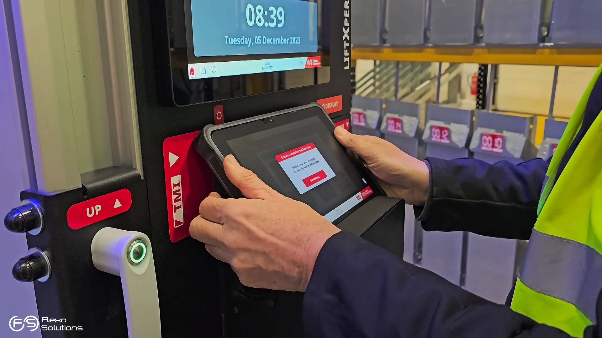 Operator using the Essential HMI tablet beside the industrial crane controls